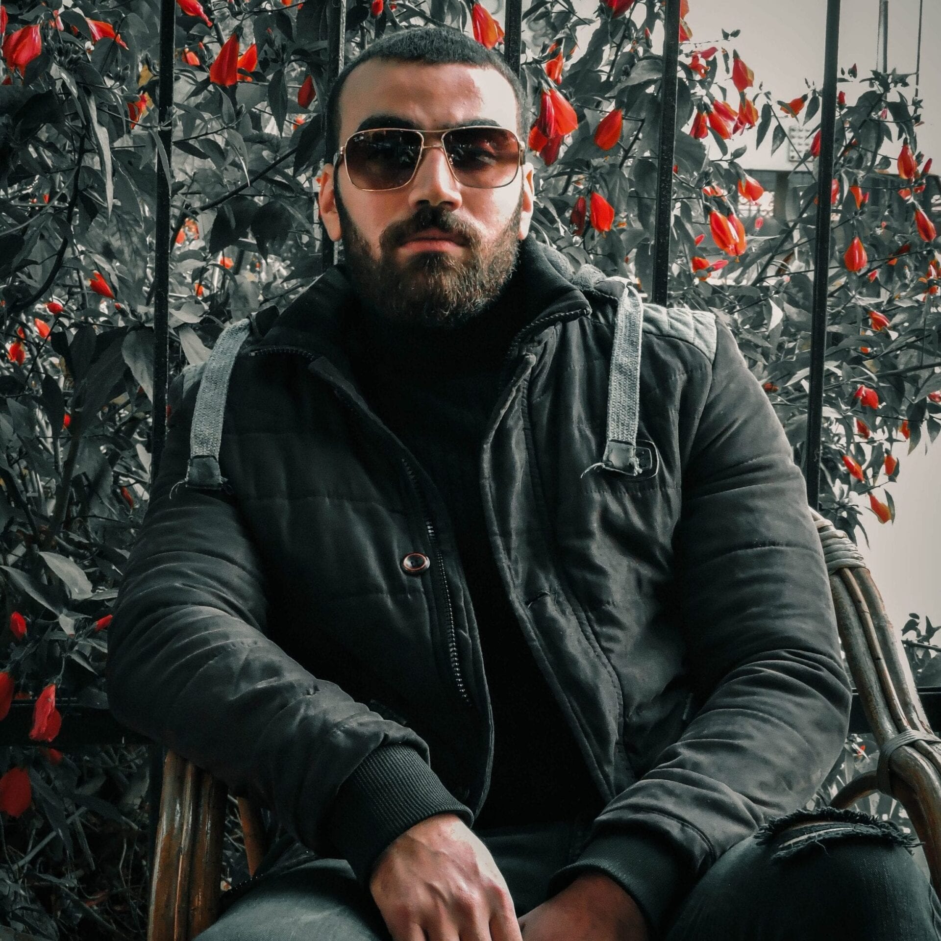 kamal-alkhatib-rClSHCQu430-unsplash Guy wearing a dark jacket and shades